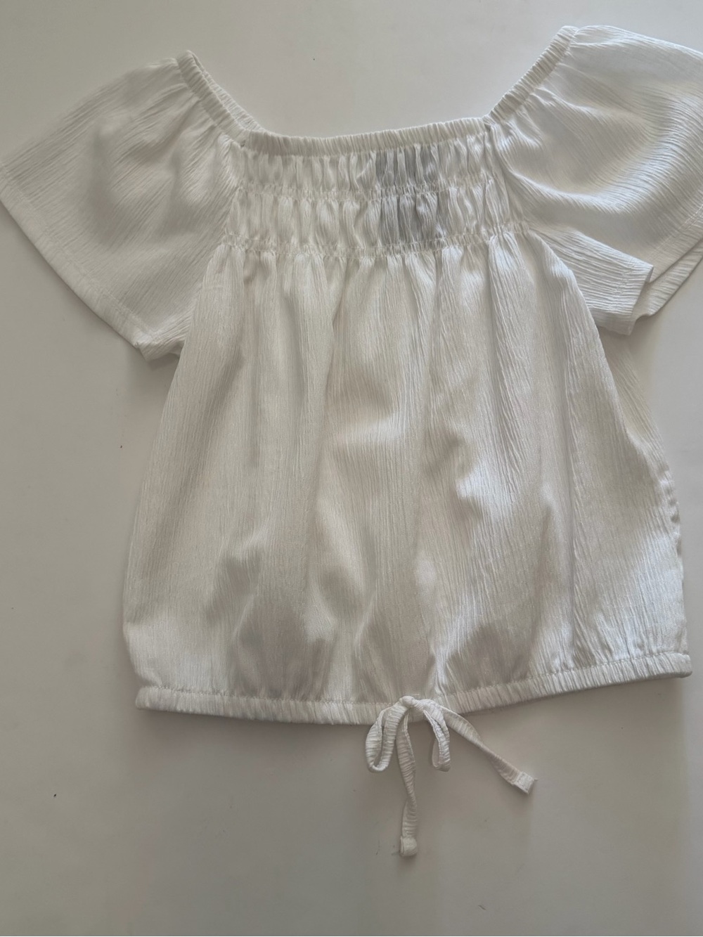 White Smocked Off-Shoulder Tie-Hem Top